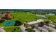 Aerial view of the community's tennis courts, golf course and clubhouse at 3041 Boating Blvd, Kissimmee, FL 34746