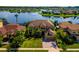 Aerial view of lakefront home showcasing its prime location and well-maintained landscaping at 3041 Boating Blvd, Kissimmee, FL 34746