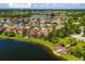 Aerial view of a property's location on the waterfront, enhanced by community amenities and lush landscaping at 3041 Boating Blvd, Kissimmee, FL 34746