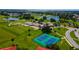 Beautiful aerial view showcasing the tennis courts and golf course in this active community at 3041 Boating Blvd, Kissimmee, FL 34746