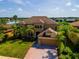 Aerial view of home with large lake in the background at 3041 Boating Blvd, Kissimmee, FL 34746
