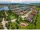 Aerial view of a charming neighborhood with homes, lakes, and a playground at 3041 Boating Blvd, Kissimmee, FL 34746