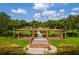 Picturesque waterfront amenity with a gazebo and landscaped grounds, perfect for relaxation and enjoyment at 3041 Boating Blvd, Kissimmee, FL 34746