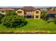 This backyard features a well-kept lawn and waterfront views at 3041 Boating Blvd, Kissimmee, FL 34746