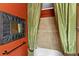 Stylish bathroom featuring a bathtub and green curtains at 3041 Boating Blvd, Kissimmee, FL 34746