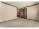 Carpeted bedroom featuring a closet and an ensuite bathroom at 3041 Boating Blvd, Kissimmee, FL 34746