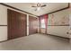 Bedroom with carpet, ceiling fan, large closet, and window at 3041 Boating Blvd, Kissimmee, FL 34746