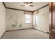 Bedroom with neutral carpet and light colored walls with lily pad mural at 3041 Boating Blvd, Kissimmee, FL 34746