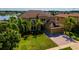 Stunning two-story home with lush landscaping, three-car garage, and elegant architectural details at 3041 Boating Blvd, Kissimmee, FL 34746