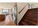 Open-concept kitchen with stainless steel appliances and adjacent staircase to upstairs at 3041 Boating Blvd, Kissimmee, FL 34746