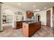 Open-concept kitchen with a large island, granite countertops, and a view of the living area at 3041 Boating Blvd, Kissimmee, FL 34746