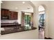 Well-equipped kitchen with dark cabinetry, granite countertops, and a breakfast nook with tropical view at 3041 Boating Blvd, Kissimmee, FL 34746