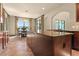 Open kitchen features an island, granite countertops, and an adjacent dining area with backyard access at 3041 Boating Blvd, Kissimmee, FL 34746