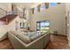 Bright living room showcasing views of the lake and lush backyard through large glass doors at 3041 Boating Blvd, Kissimmee, FL 34746