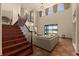 Well-lit living room with a staircase, overlooking the lake, with access to the dining area at 3041 Boating Blvd, Kissimmee, FL 34746