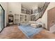 Spacious living area with a staircase, built-in shelving, and tile floors at 3041 Boating Blvd, Kissimmee, FL 34746