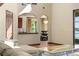 Open-concept living room showcasing the kitchen, dining area, and lake view at 3041 Boating Blvd, Kissimmee, FL 34746