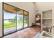 Living room with large sliding glass doors overlooking a lake and access to the patio at 3041 Boating Blvd, Kissimmee, FL 34746