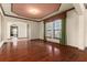Spacious living room featuring hardwood floors, large windows, and decorative ceiling at 3041 Boating Blvd, Kissimmee, FL 34746