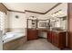 Bright main bathroom featuring double sinks, a soaking tub, and a standalone shower at 3041 Boating Blvd, Kissimmee, FL 34746