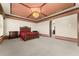 Spacious main bedroom featuring a tray ceiling with chandelier and a decorative archway at 3041 Boating Blvd, Kissimmee, FL 34746