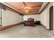 Main bedroom with a decorative trey ceiling, chandelier, and neutral carpeting at 3041 Boating Blvd, Kissimmee, FL 34746