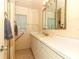 Bright bathroom with a large vanity and double mirrors at 317 White Oak Dr, Altamonte Springs, FL 32701