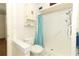 Bathroom featuring a walk in shower and toilet with storage cabinet above at 317 White Oak Dr, Altamonte Springs, FL 32701