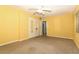 Bedroom with neutral carpet, ceiling fan, and double door closet at 317 White Oak Dr, Altamonte Springs, FL 32701