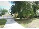 Charming yellow home with a detached garage, complemented by mature trees at 317 White Oak Dr, Altamonte Springs, FL 32701