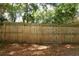 A well-maintained, solid wooden fence offers privacy to the backyard at 317 White Oak Dr, Altamonte Springs, FL 32701