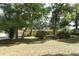 Charming yellow home with a lush front yard and mature trees offering ample shade and curb appeal at 317 White Oak Dr, Altamonte Springs, FL 32701