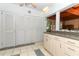 Kitchen area featuring ample cabinet space and a view of the adjoining dining room at 317 White Oak Dr, Altamonte Springs, FL 32701