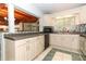 The kitchen has plenty of counterspace and cabinets with a window above the sink at 317 White Oak Dr, Altamonte Springs, FL 32701