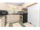 Kitchen with appliances and ample cabinet space featuring a stainless steel oven at 317 White Oak Dr, Altamonte Springs, FL 32701