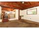 Bright living space with wood beam ceiling, and adjacent wet bar with views into the dining and kitchen area at 317 White Oak Dr, Altamonte Springs, FL 32701