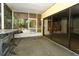 Enclosed patio featuring sliding glass doors and screened windows at 317 White Oak Dr, Altamonte Springs, FL 32701