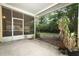 Enclosed patio offering a tranquil outdoor space with access to the lush backyard at 317 White Oak Dr, Altamonte Springs, FL 32701