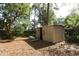 Spacious storage shed in the backyard surrounded by lush greenery at 317 White Oak Dr, Altamonte Springs, FL 32701