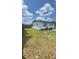 Spacious backyard with a privacy fence, offering ample space for outdoor activities and relaxation at 331 N Dollins Ave, Orlando, FL 32805
