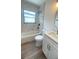 Renovated bathroom with tub, shower, new vanity and modern fixtures at 331 N Dollins Ave, Orlando, FL 32805