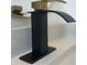 Close-up view of a black and gold faucet on a white quartz countertop at 331 N Dollins Ave, Orlando, FL 32805