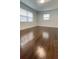 Bedroom with hardwood floors and natural light from two windows at 331 N Dollins Ave, Orlando, FL 32805