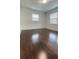 Bedroom featuring hardwood floors and natural lighting at 331 N Dollins Ave, Orlando, FL 32805