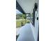 Relaxing covered front porch with minimalist plants and dark trim at 331 N Dollins Ave, Orlando, FL 32805
