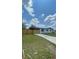 A single story house with a big yard, new fence and a long driveway at 331 N Dollins Ave, Orlando, FL 32805