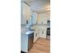 Modern kitchen featuring stainless steel appliances, white cabinets, and quartz countertops at 331 N Dollins Ave, Orlando, FL 32805