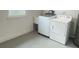 Clean laundry room with modern washer, dryer, and utility sink at 331 N Dollins Ave, Orlando, FL 32805