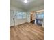 Living room view with wood floors and access to the kitchen at 331 N Dollins Ave, Orlando, FL 32805