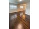 Spacious living room featuring beautiful hardwood flooring and natural light at 331 N Dollins Ave, Orlando, FL 32805